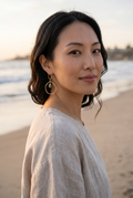 Sand and Sea geometric drop earrings with gold-tone finish, pyrite stone accent, and unique hoop design.