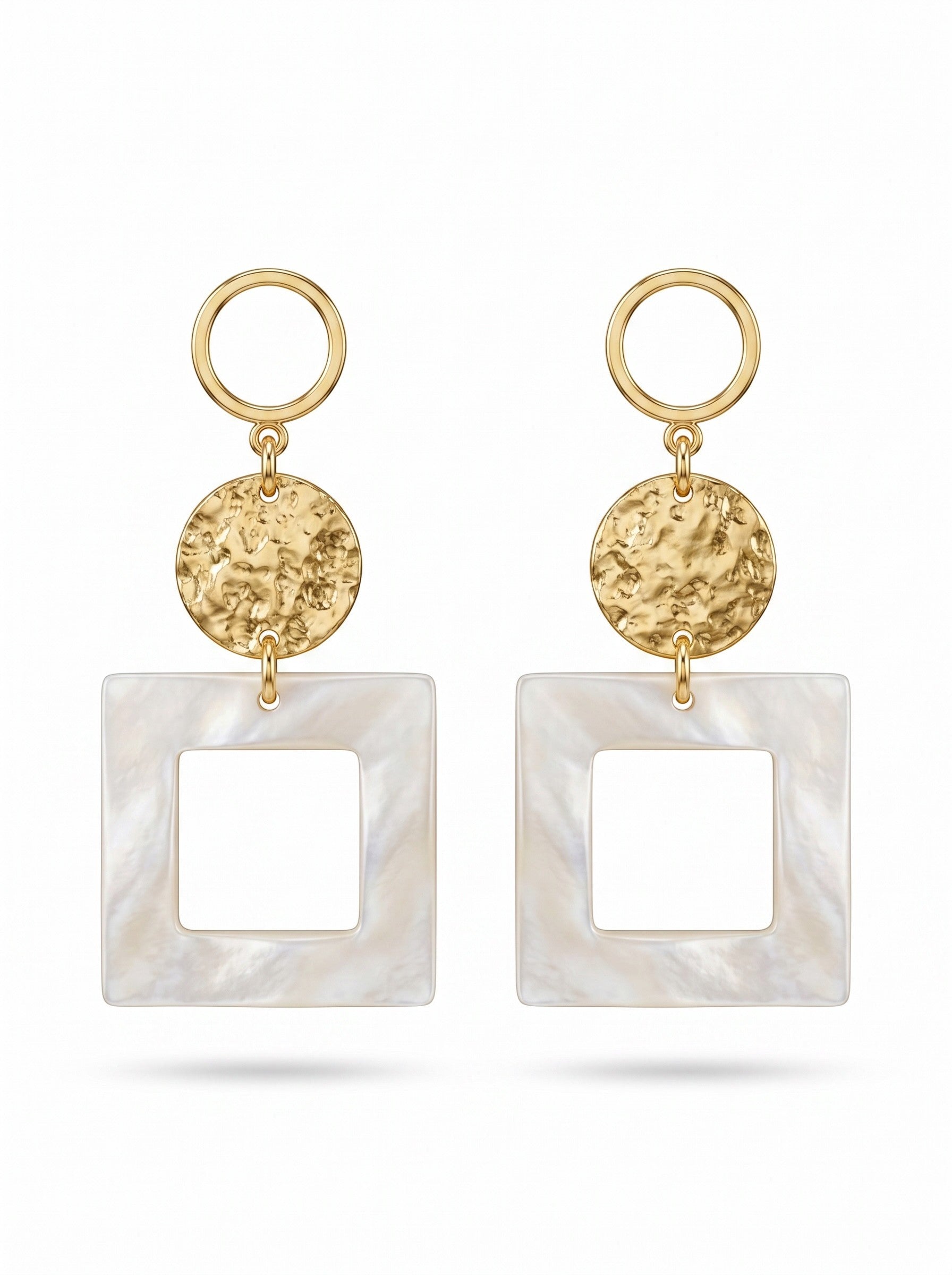 Sand and Sea geometric drop earrings with gold-tone hammered discs and matte white square frames.