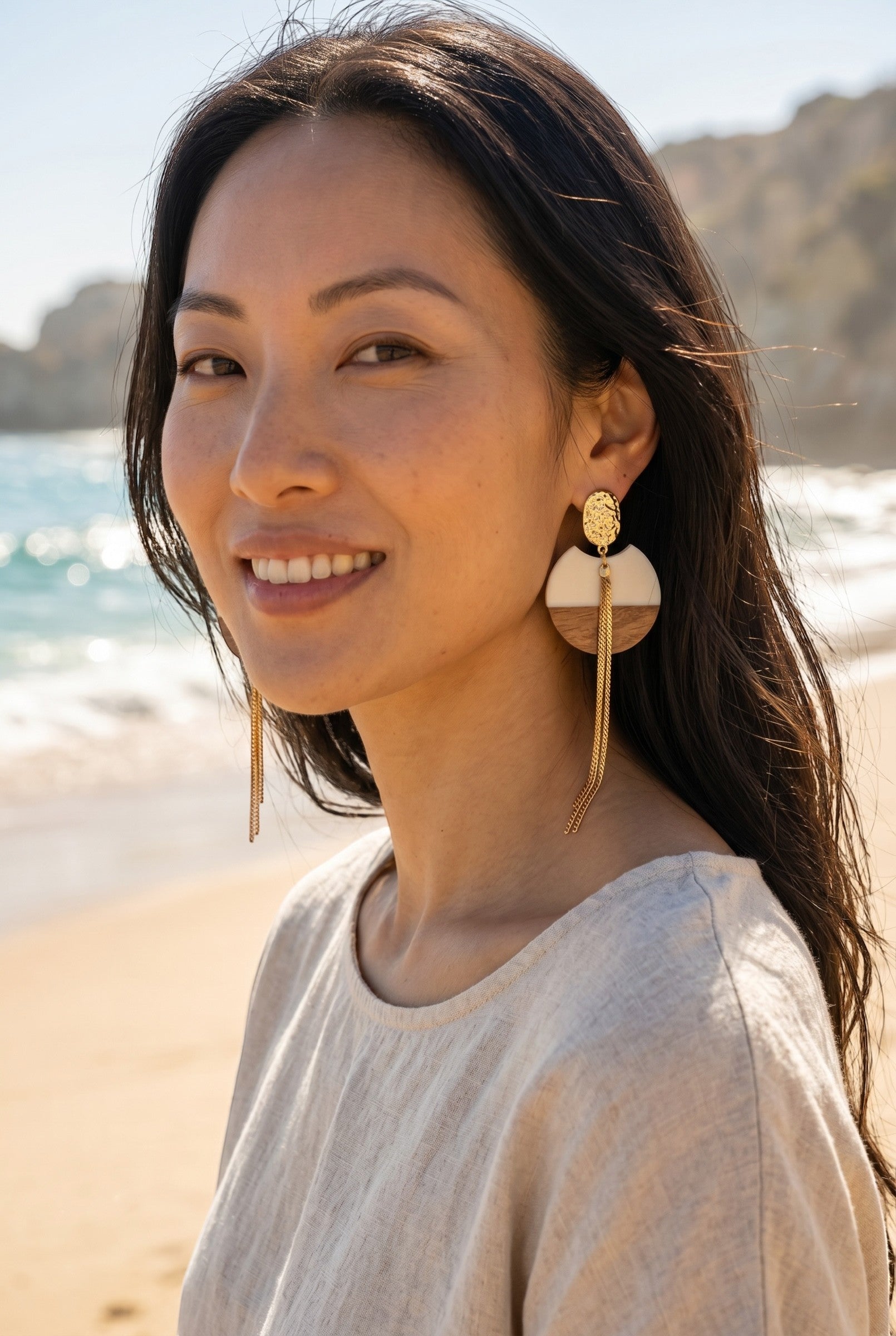 Sand and Sea geometric wood and gold metal drop earrings with cascading chains.