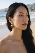 Sand and Sea geometric wood and stripe round drop earrings with brushed gold post and hammered gold disc.