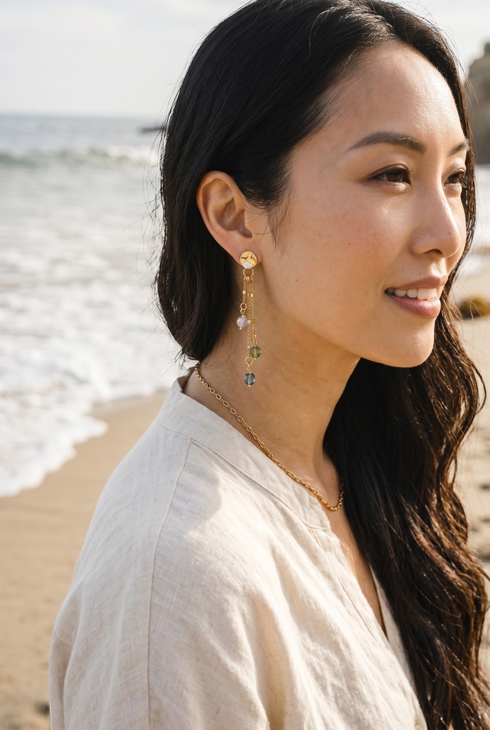 Sand and Sea gold plated drop earrings with pastel beads and delicate chains cascading.