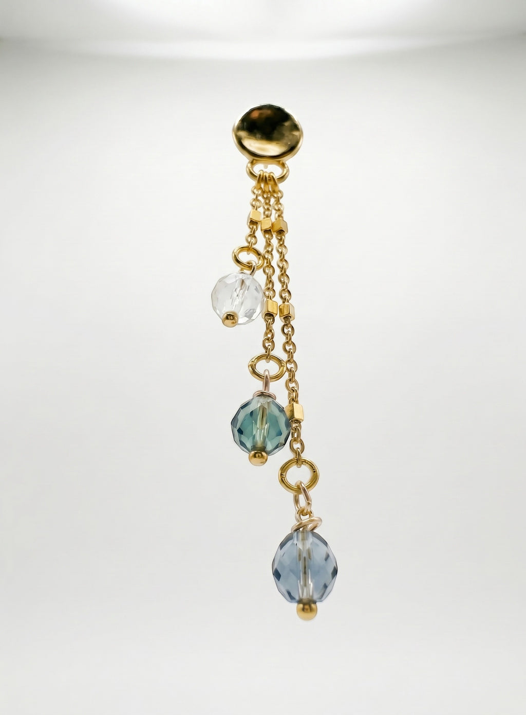 Sand and Sea gold plated drop earrings with clear, teal, and blue faceted beads on delicate chains.