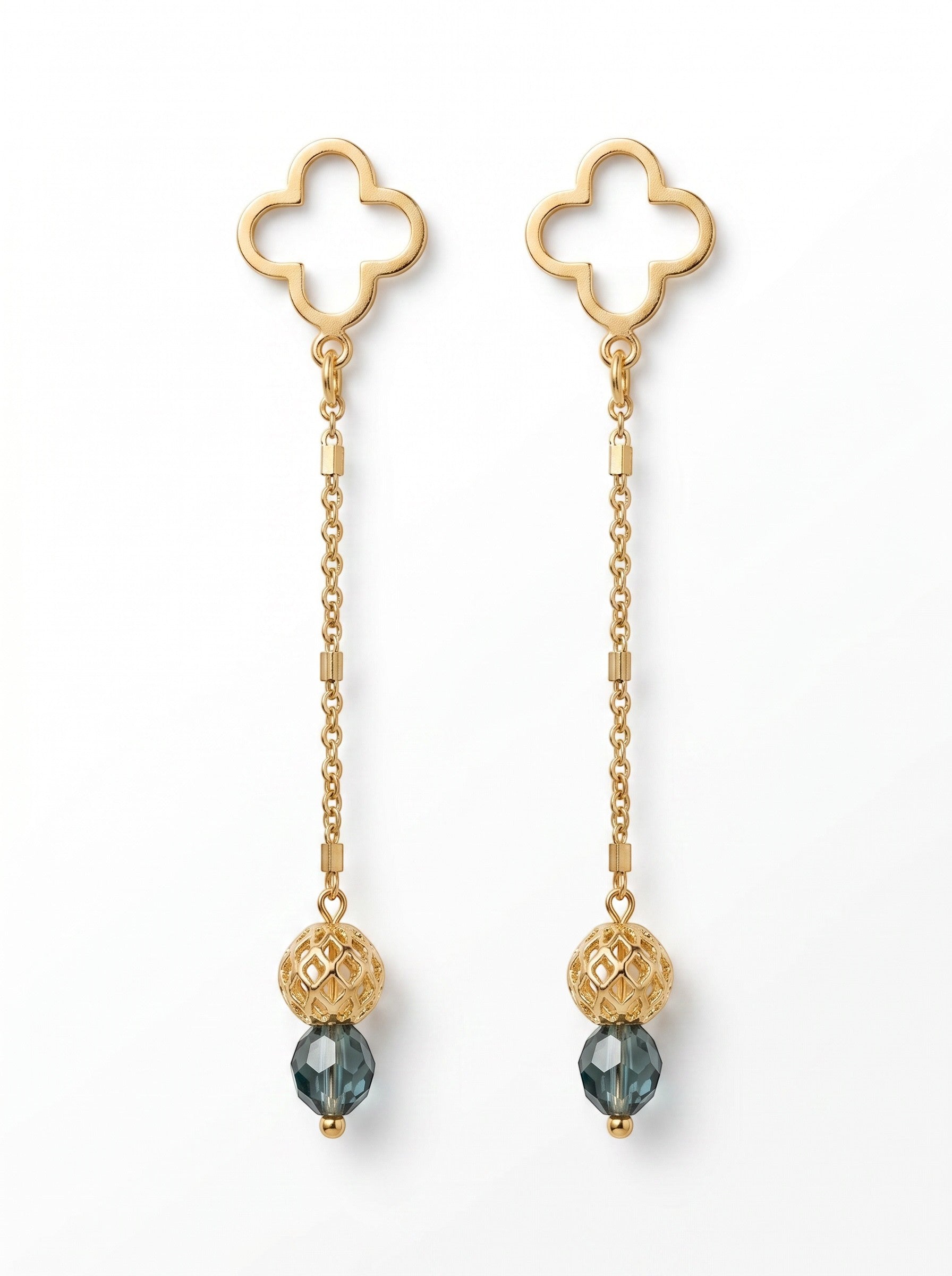Sand and Sea gold-tone drop earrings with clover studs, chain, and blue gemstone accents.
