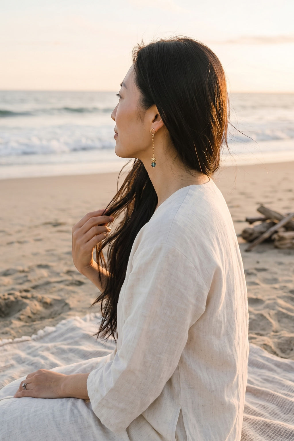 Sand and Sea gold-tone drop earrings with clover stud and blue gemstone bead