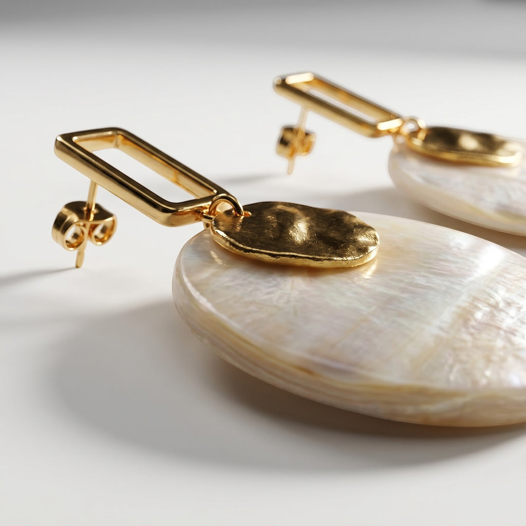 Sand and Sea white and cream marbled disc earrings with gold-tone rectangular frame.