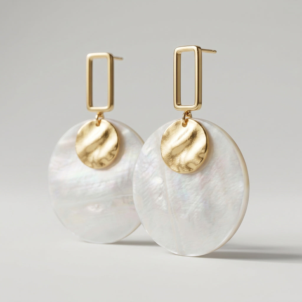 Sand and Sea white and cream marbled disc earrings with gold rectangular frame and hammered disc accent.