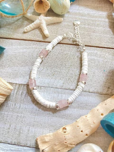 Sand and Sea handmade boho beach bracelet with white pukka shell heshi beads and rose quartz accents.