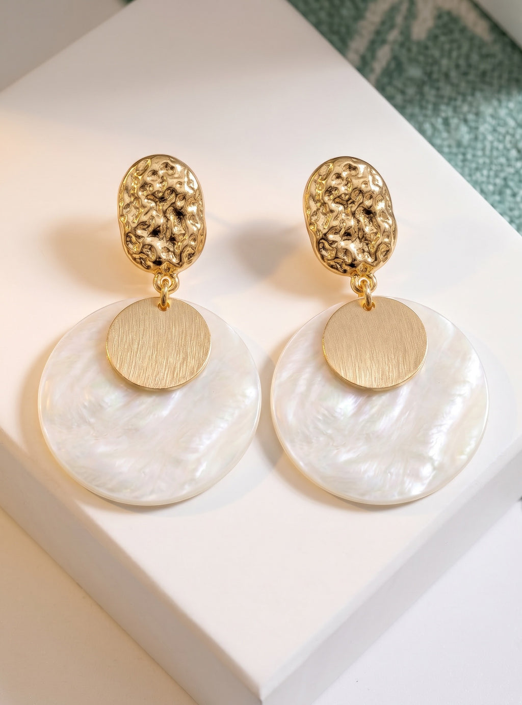 Sand and Sea white iridescent shell disc earrings with gold accent and hammered texture