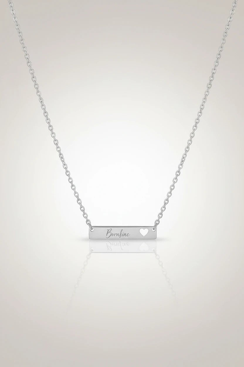 Sand and Sea silver bar necklace with cutout heart and "Borahae" engraving, made of stainless steel.