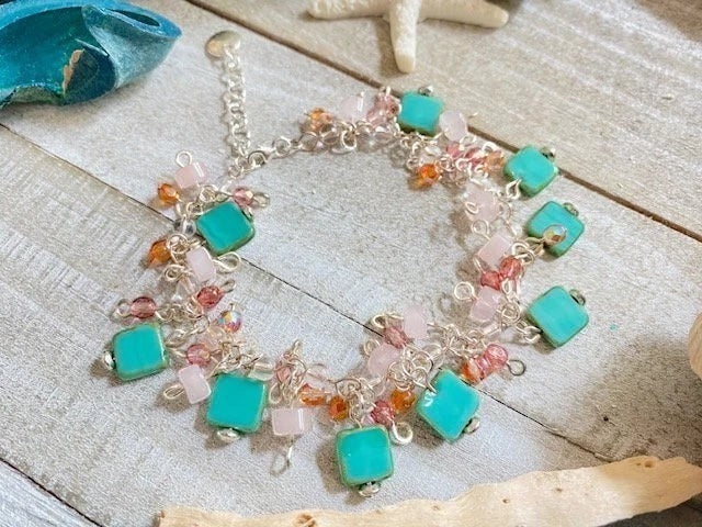 Sand and Sea handmade teal Czech glass beaded bracelet with rose quartz and sterling silver charms.